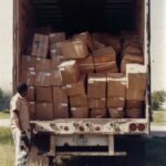 The back of the Wal Mart truck filled with donated new shoes on the Pine Ridge Rez