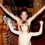 Gregg & Tae celebrating their win on the living room basketball small play hoop.