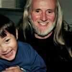 Dik holding Rhonda's son Aiko.