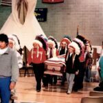 As you face the picture, I am in front on the right side as we walk towards you. The Pine Ridge Agency Oglala Tribal Chairman on the left. We all wore a Chiefs Bonnet.